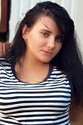 Ukrainian girl Alena,22 years old with brown eyes and black hair.