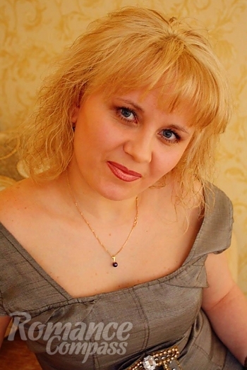 Ukrainian mail order bride Olga from Nikolaev with blonde hair and blue eye color - image 1
