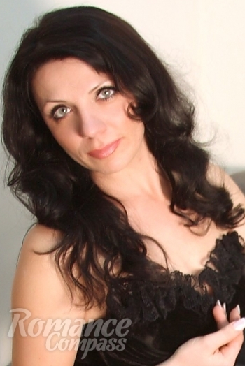 Ukrainian mail order bride Irina from Nikolaev with black hair and green eye color - image 1