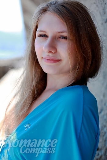 Ukrainian mail order bride Daria from Yalta with light brown hair and blue eye color - image 1