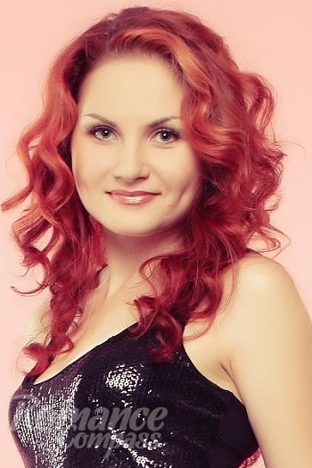 Ukrainian mail order bride Nadezshda from Nikolaev with red hair and green eye color - image 1