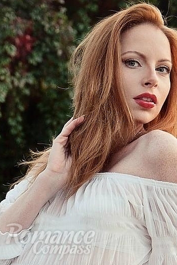 Ukrainian mail order bride Irina from Donetsk with red hair and green eye color - image 1