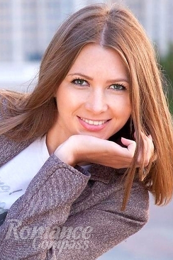 Ukrainian mail order bride Olga from Kiev with red hair and green eye color - image 1
