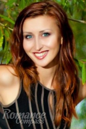 Ukrainian girl Irina,29 years old with green eyes and red hair.