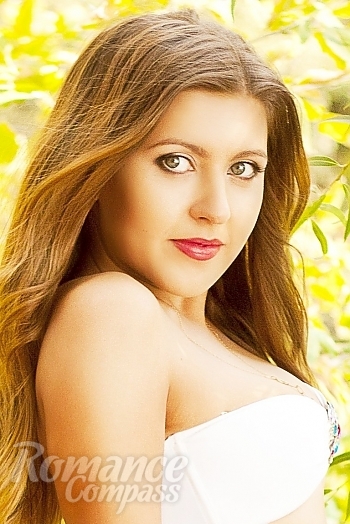 Ukrainian mail order bride Nadya from Nikolaev with light brown hair and green eye color - image 1
