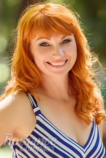Ukrainian mail order bride Oksana from Poltava with red hair and green eye color - image 1