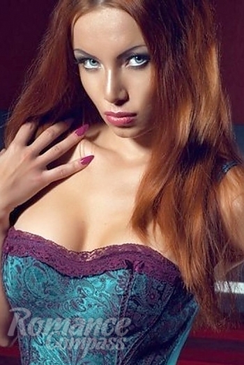 Ukrainian mail order bride Ksenia from Donetsk with red hair and blue eye color - image 1