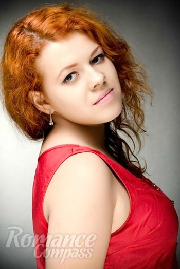 Ukrainian mail order bride Mahsa from Nikolaev with red hair and green eye color - image 1