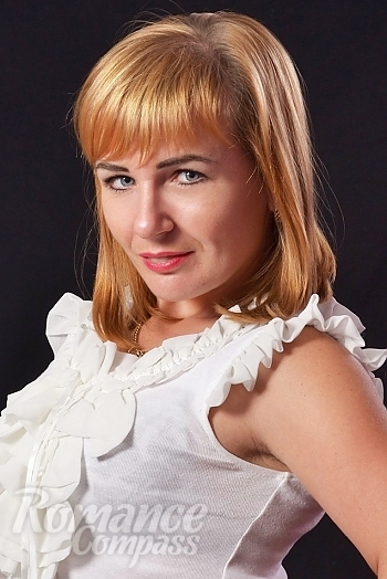 Ukrainian mail order bride Galina from Kharkov with light brown hair and blue eye color - image 1