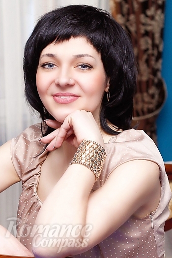 Ukrainian mail order bride Oksana from Klevan with black hair and blue eye color - image 1