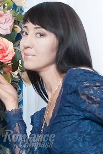 Ukrainian mail order bride Olga from Odessa with black hair and brown eye color - image 1
