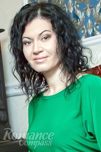 Ukrainian mail order bride Irina from Odessa with black hair and hazel eye color - image 1