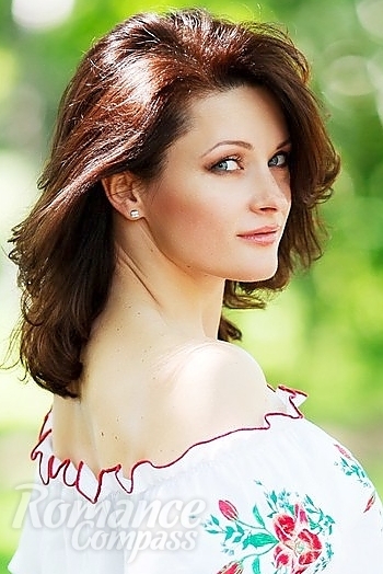 Ukrainian mail order bride Olga from Kharkov with brunette hair and blue eye color - image 1