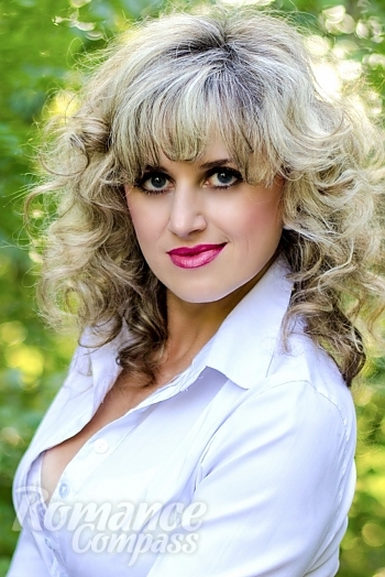 Ukrainian mail order bride Tatiana from Nikolaev with light brown hair and blue eye color - image 1
