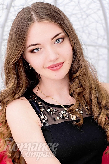 Ukrainian mail order bride Ekaterina from Kharkov with light brown hair and blue eye color - image 1