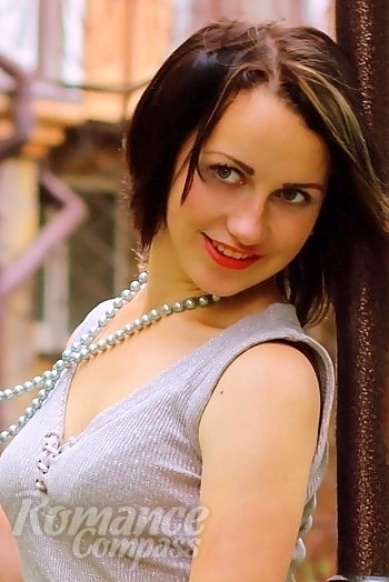 Ukrainian mail order bride Snezhana from Kherson with black hair and green eye color - image 1