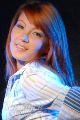 Ukrainian mail order bride Oksana from Lugansk with red hair and green eye color - image 1