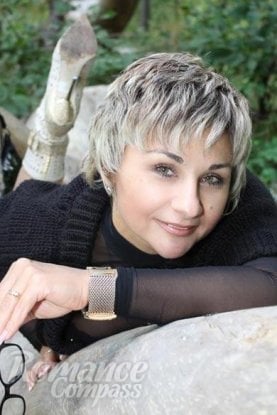 Ukrainian girl Elena,55 years old with brown eyes and blonde hair.