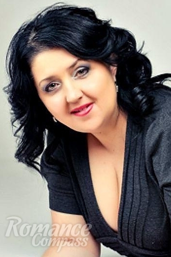 Ukrainian mail order bride Svetlana from Nikolaev with black hair and green eye color - image 1
