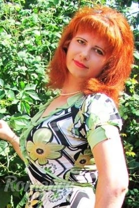 Ukrainian mail order bride Svetlana from Kiev with red hair and hazel eye color - image 1
