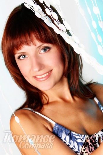 Ukrainian mail order bride Olga from Kharkov with light brown hair and green eye color - image 1