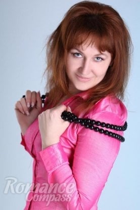 Ukrainian girl Anzhela,56 years old with grey eyes and red hair.