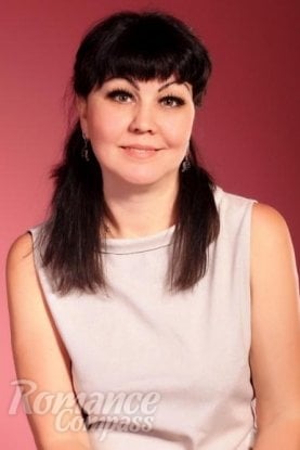 Ukrainian girl Alexandra,57 years old with brown eyes and black hair.