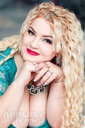 Ukrainian mail order bride Yana from Nikolaev with blonde hair and green eye color - image 1
