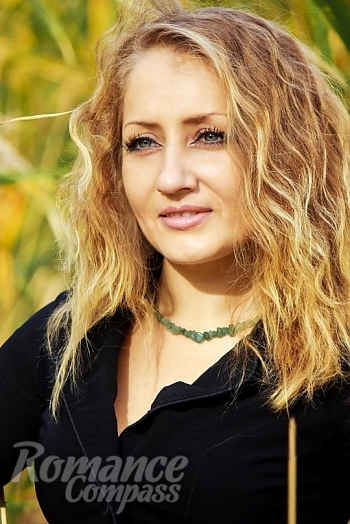 Ukrainian mail order bride Irina from Nikolaev with light brown hair and hazel eye color - image 1
