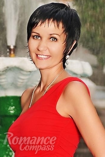 Ukrainian mail order bride Oksana from Nikolaev with black hair and blue eye color - image 1