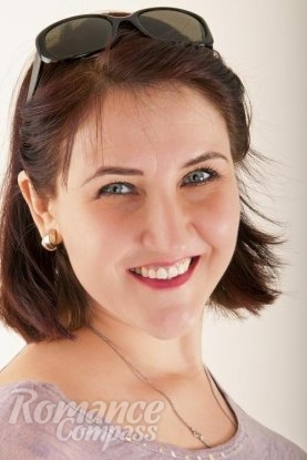 Ukrainian girl Anna,55 years old with green eyes and light brown hair.