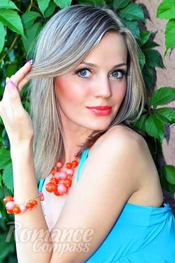 Ukrainian mail order bride Ivanna from Nikolaev with blonde hair and blue eye color - image 1