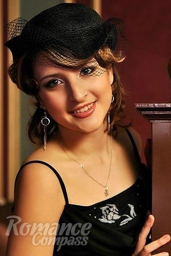 Ukrainian mail order bride Polina from Poltava with light brown hair and green eye color - image 1