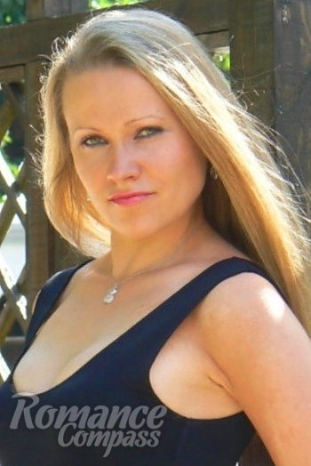 Ukrainian mail order bride Larisa from Yalta with blonde hair and blue eye color - image 1