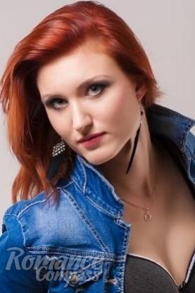 Ukrainian girl Anna,34 years old with blue eyes and red hair.
