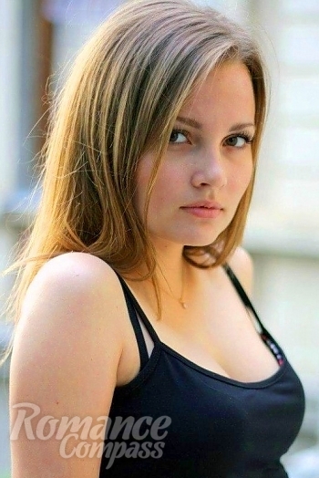 Ukrainian mail order bride Arina from Nikolaev with light brown hair and hazel eye color - image 1