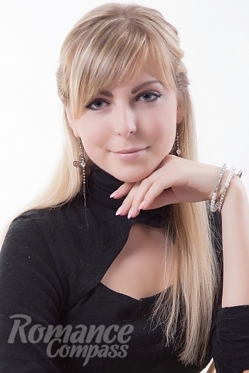 Ukrainian mail order bride Olga from Kiev with blonde hair and blue eye color - image 1