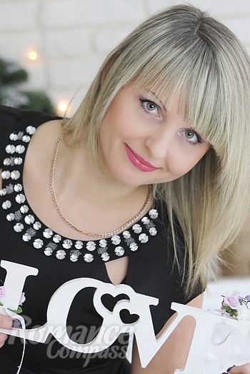 Ukrainian mail order bride Irina from Nikolaev with blonde hair and green eye color - image 1