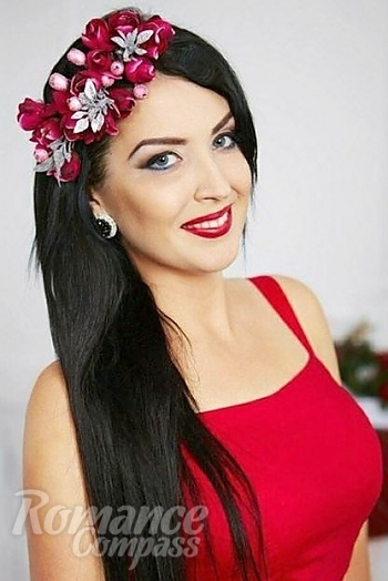 Ukrainian mail order bride Ruslana from Kostopil with brunette hair and blue eye color - image 1