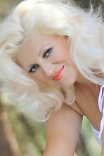 Ukrainian girl Svetlana,49 years old with blue eyes and blonde hair.