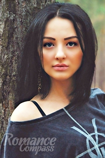 Ukrainian mail order bride Oksana from Nikolaev with black hair and blue eye color - image 1