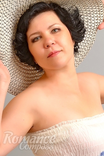 Ukrainian mail order bride Camila from Nikolaev with black hair and grey eye color - image 1