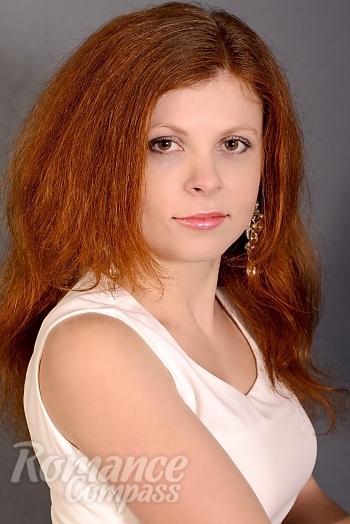 Ukrainian mail order bride Julia from Nikolaev with red hair and green eye color - image 1