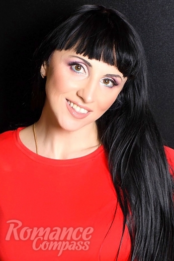 Ukrainian mail order bride Tatyana from Kharkov with black hair and green eye color - image 1
