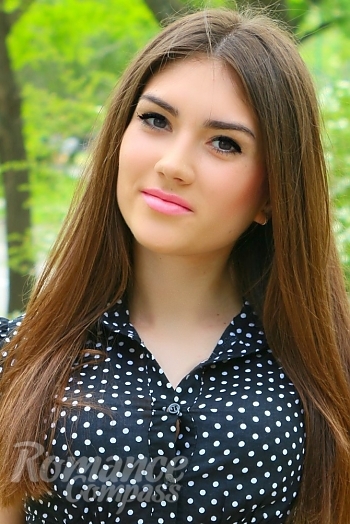 Ukrainian mail order bride Nastya from Nikolaev with brunette hair and black eye color - image 1