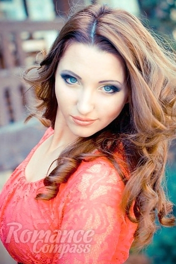 Ukrainian mail order bride Oksana from Nikolaev with light brown hair and green eye color - image 1