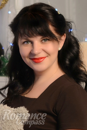 Ukrainian mail order bride Oksana from Kherson with black hair and grey eye color - image 1