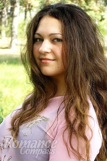 Ukrainian mail order bride Oksana from Kherson with brunette hair and green eye color - image 1