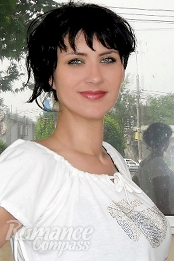 Ukrainian mail order bride Julia from Nikolaev with black hair and green eye color - image 1