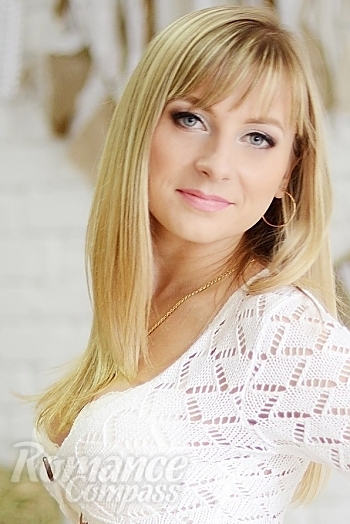 Ukrainian mail order bride Anna from Nikolaev with blonde hair and blue eye color - image 1